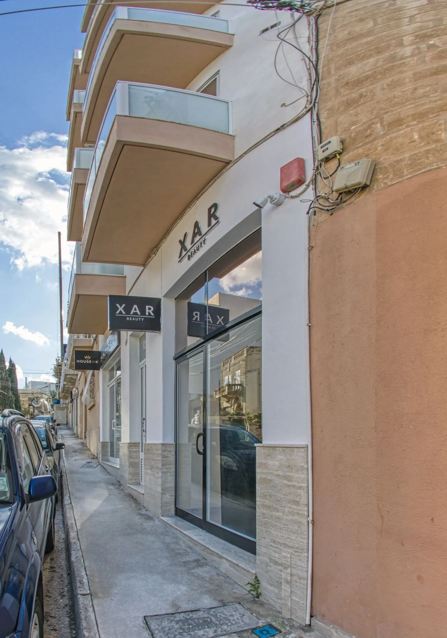 The XAR Beauty shopfront on Triq Ta’ l-Ibraġ, with the lit sign above the window